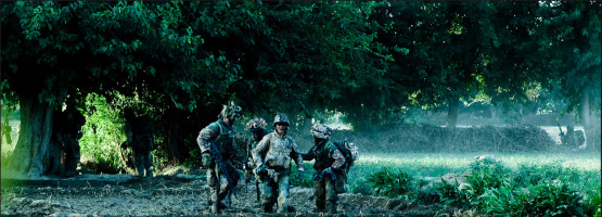 Rasmus, Frederik and Kim heading toward the Medivac after Frederik was shot in the leg 