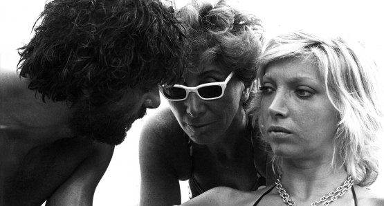 Lina Wertmüller with stars Giancarlo Giannini and Mariangela Melato on the set of SWEPT AWAY.