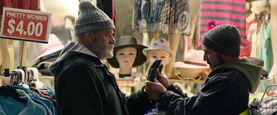 Levan Tediashvili (Kakhi) and Giorgi Tabidze (Soso) shopping on the boardwalk of Brighton Beach, Brooklyn, in Brighton 4th, directed by Levan Koguashvili. Image courtesy of Kino Lorber