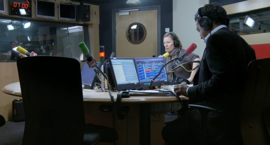 Angélique Boulon and Patrick Cohen in LA MAISON DE LA RADIO, a film by Nicolas Philibert.