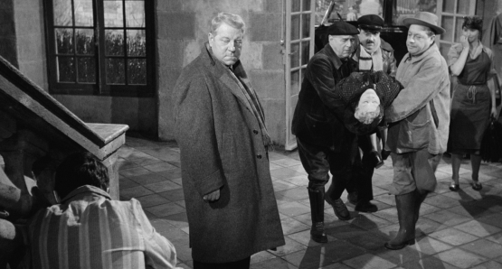 The body of the murdered Countess St. Fiacre (Valentine Tessier) is carried into her home in MAIGRET AND THE ST. FIACRE CASE.