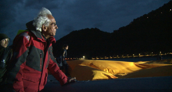 Christo in a scene from <i>Walking on Water</i>, courtesy Kino Lorber
